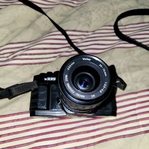 Vivitar V335 Camera (film) with attachments